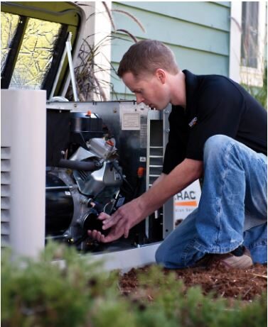 Skilled technician from GenCo Florida performing routine maintenance on a standby generator in Kingsland, Georgia, for optimal performance